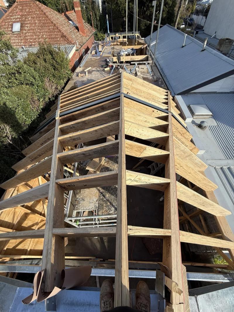 New timber roof framing between neighbouring rooftops